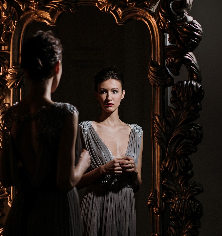 Woman Gazing into a Dark Mirror