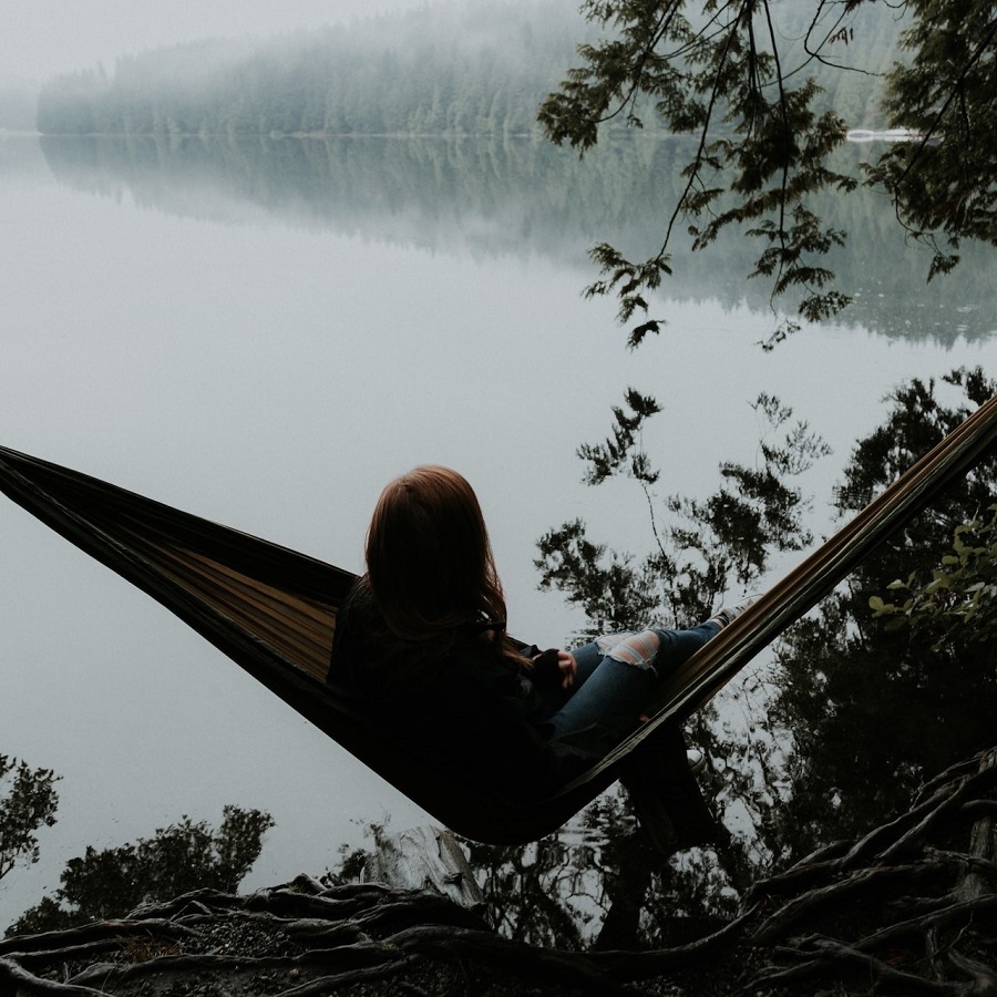 Girl hammocking in the mountains