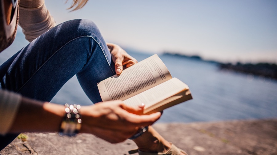 Girl Reading at the Beach