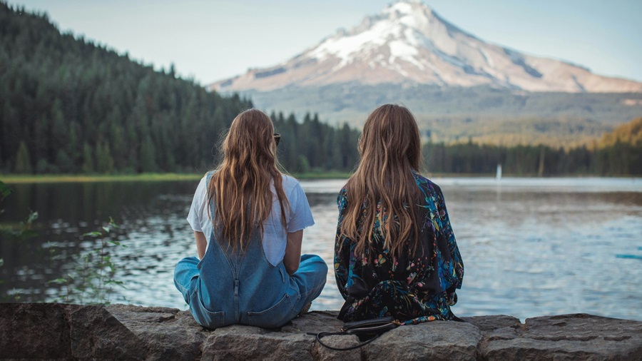 Women Sitting at a Lake