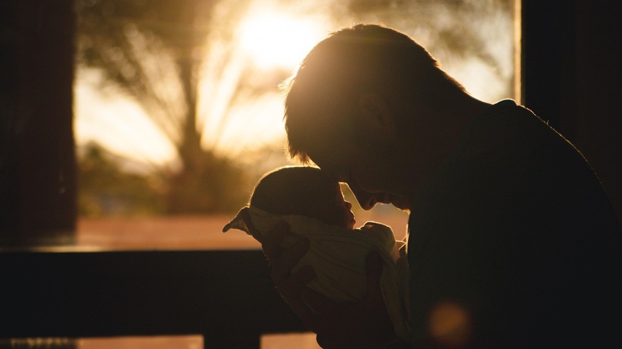 Dad holding his baby