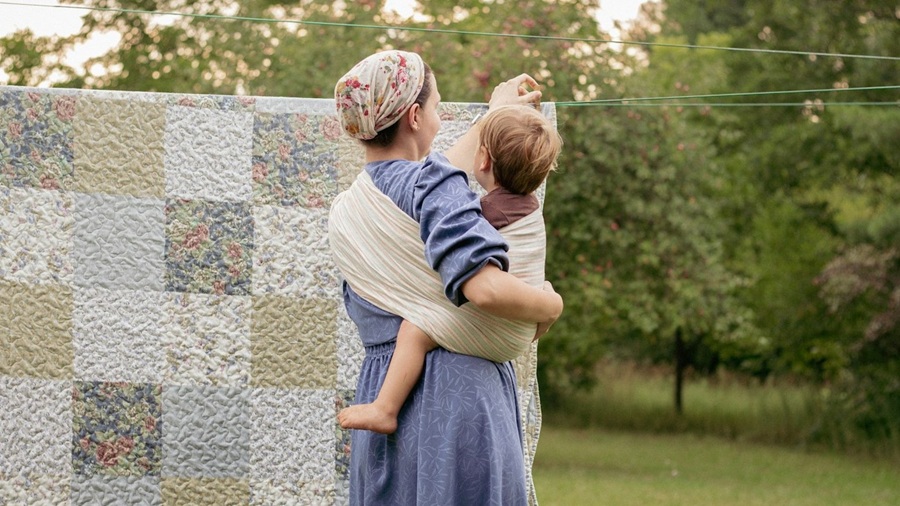 Woman with a child on her hip