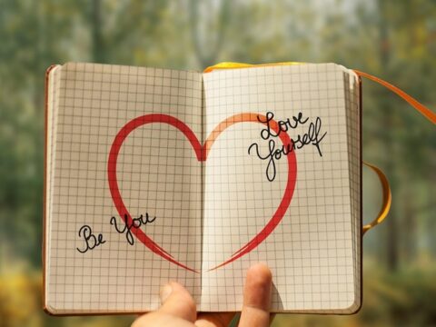 Hand Holding a Note about Self-Doubt