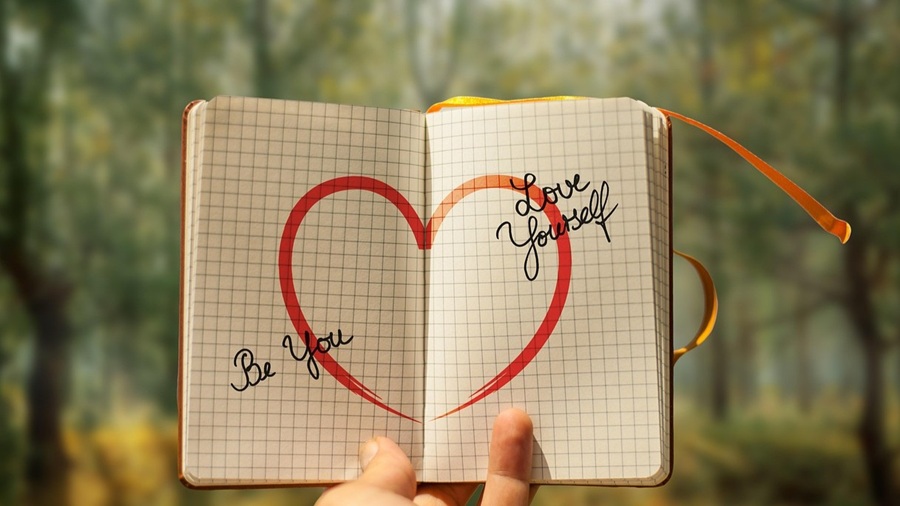 Hand Holding a Note about Self-Doubt