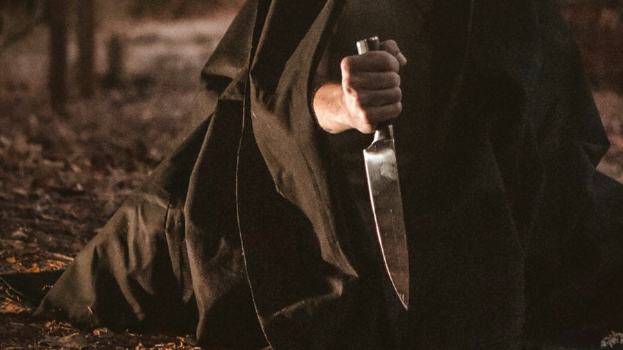 Dark Ominous Figure with a Knife